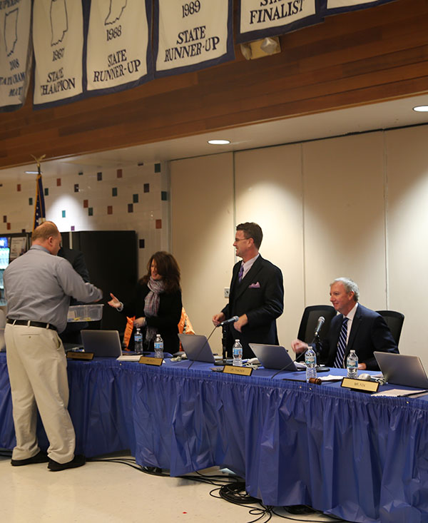 Mr. Reininga gives the Board the student gifts