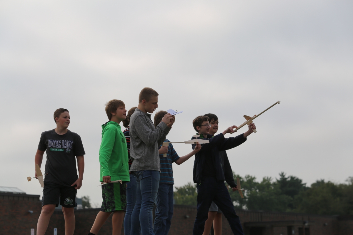 students launching planes