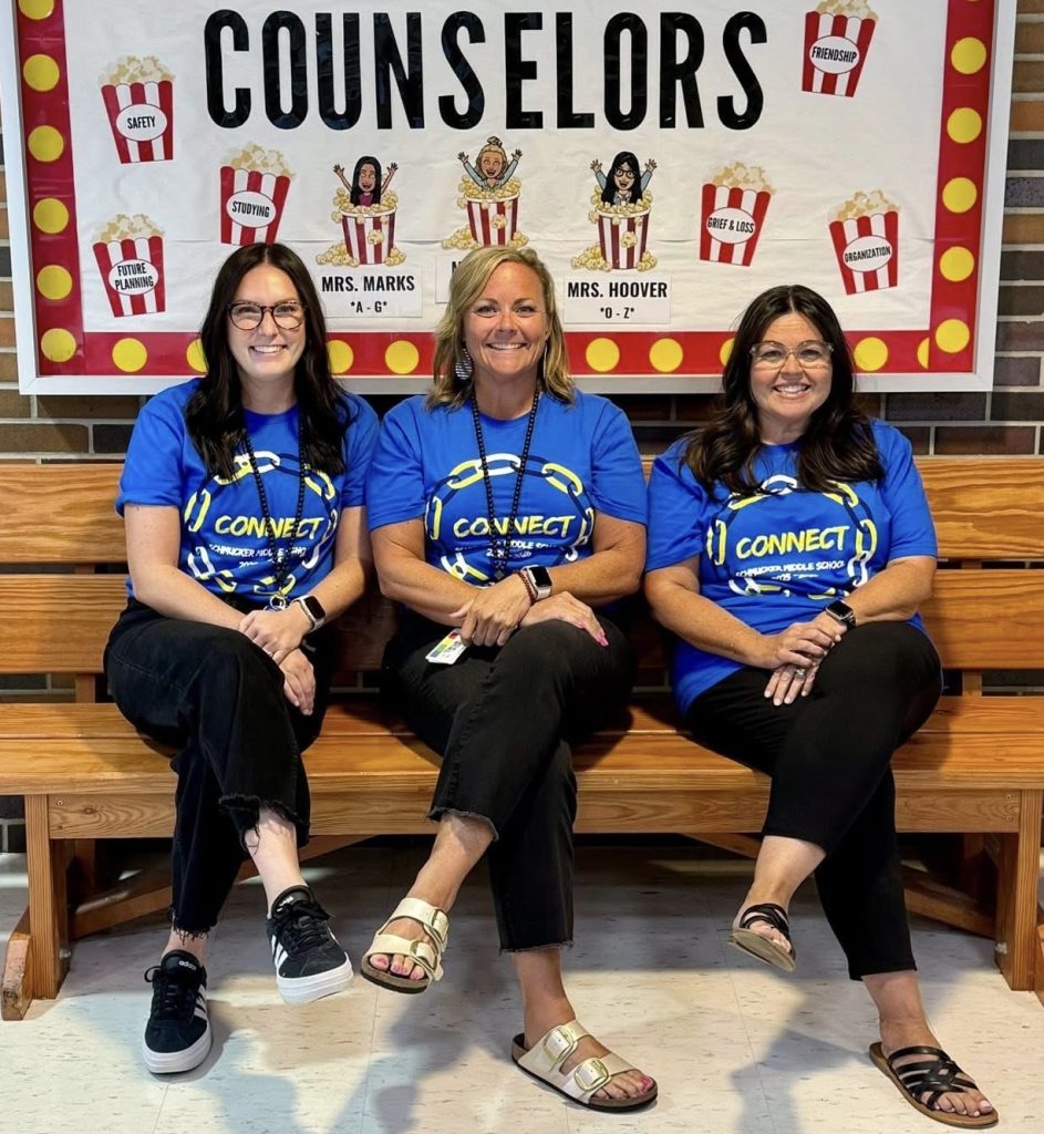 3 Women who are Schmucker Counselors sit on a bench
